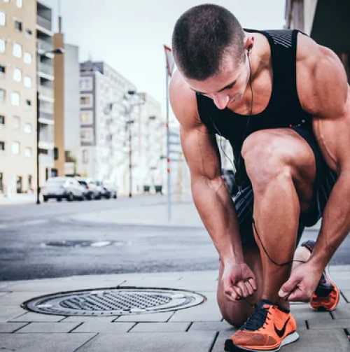 A man tying shoelaces